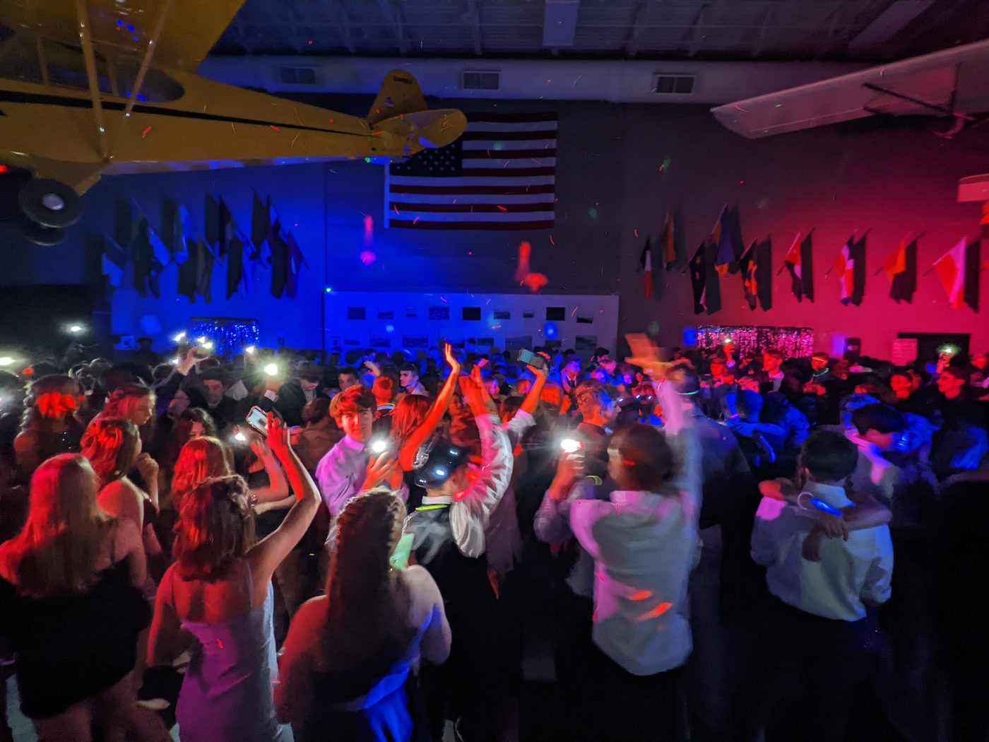 Packed dance floor with confetti at a Michigan wedding reception