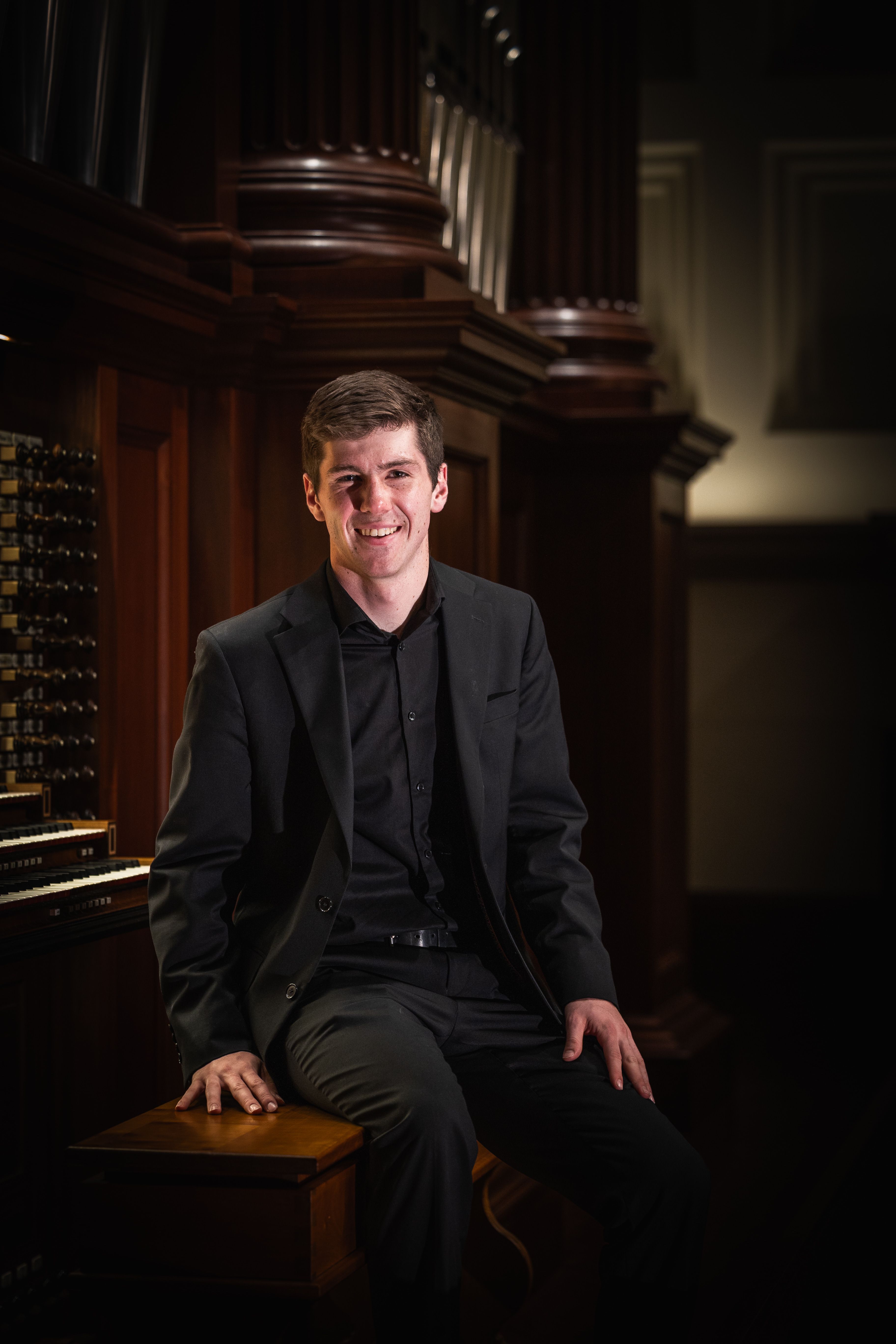 Seated at the pipe organ